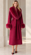 Full front view of model wearing long wine red wrap coat with plush collar and cuffs