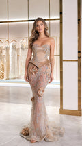 Front full-length view of champagne strapless beaded mermaid gown with peplum waist