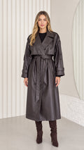 Full-length front view of woman wearing dark brown faux leather belted trench coat