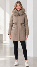 Front view of model wearing taupe faux fur hooded winter parka with drawstring waist
