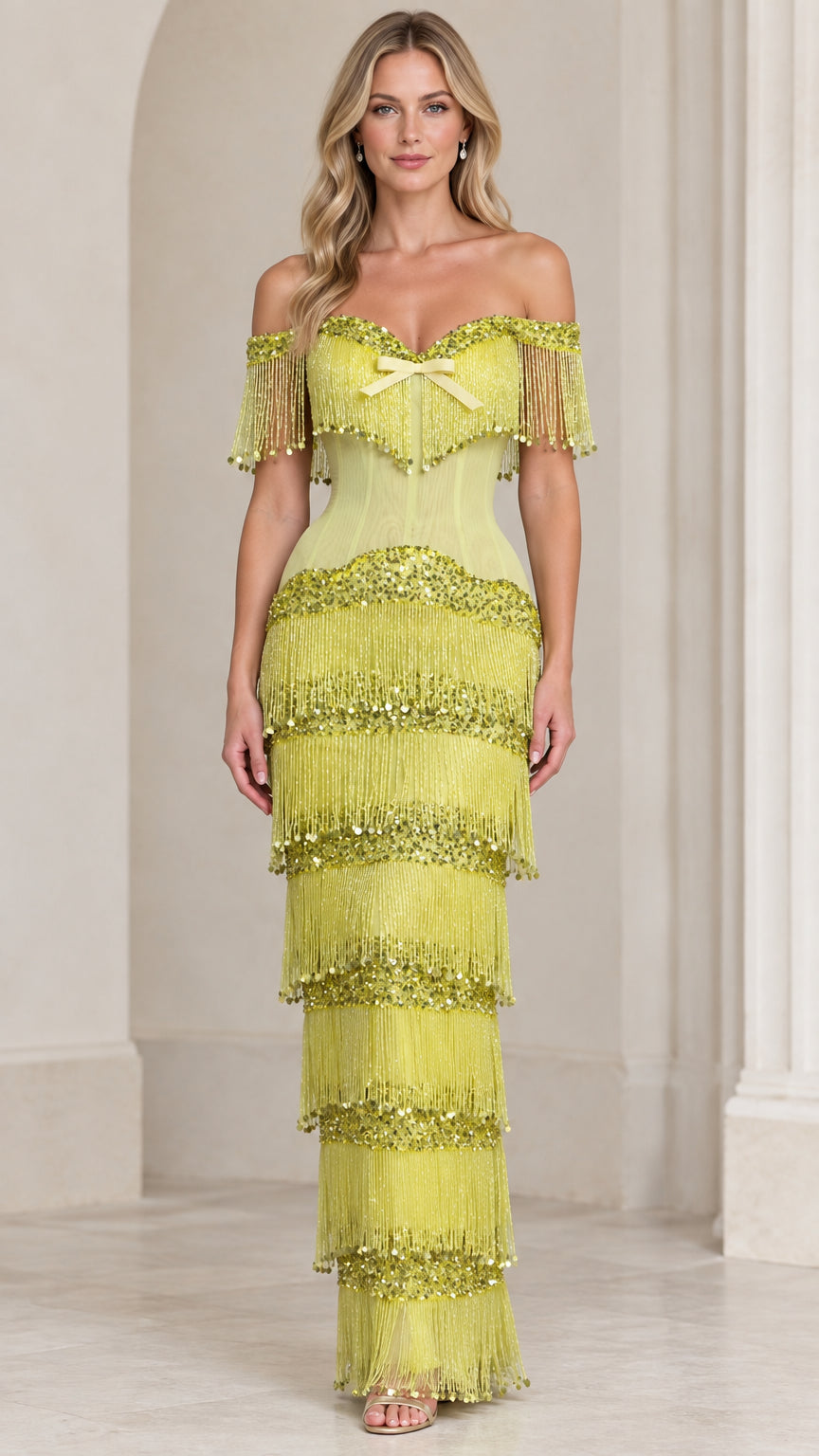 Front view of model wearing chartreuse off-the-shoulder tiered fringe sequin corset maxi gown