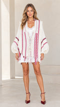 Front view of model wearing cream boho embroidered fringe cardigan with balloon sleeves