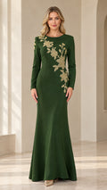 Front view of model wearing emerald green long sleeve evening gown with gold floral embroidery