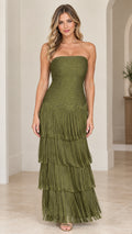 Front view of woman wearing strapless olive green tiered fringe maxi dress with rhinestone bodice