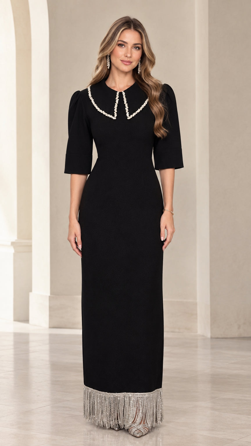 Front view of black pearl embellished collar maxi dress with fringe hem