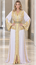 Front full view of woman wearing white Moroccan kaftan maxi dress with gold embroidery and belt