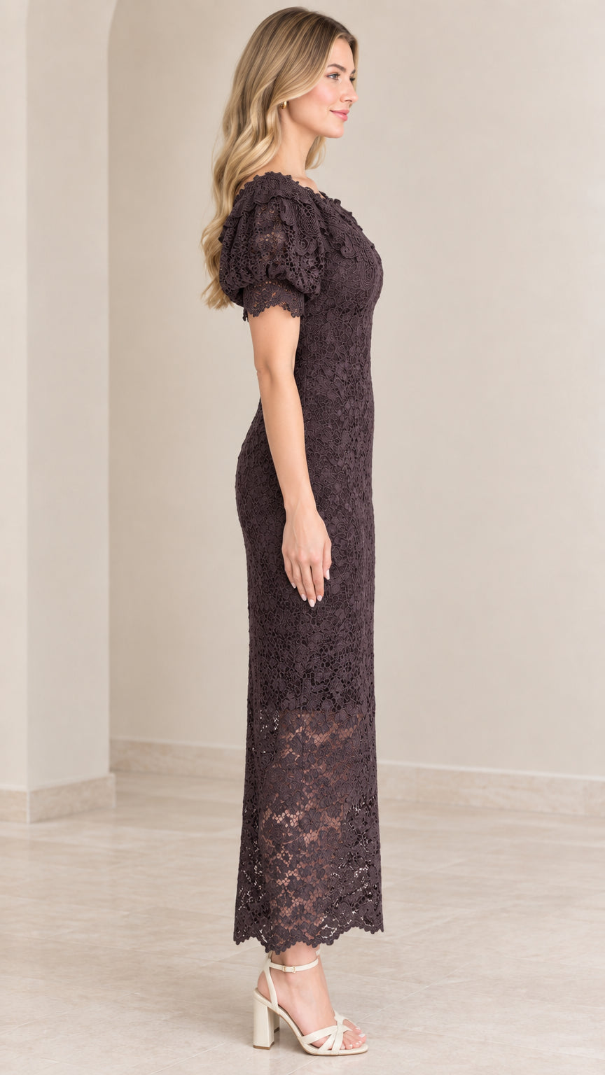 Side profile of woman in dark plum floral lace column maxi dress