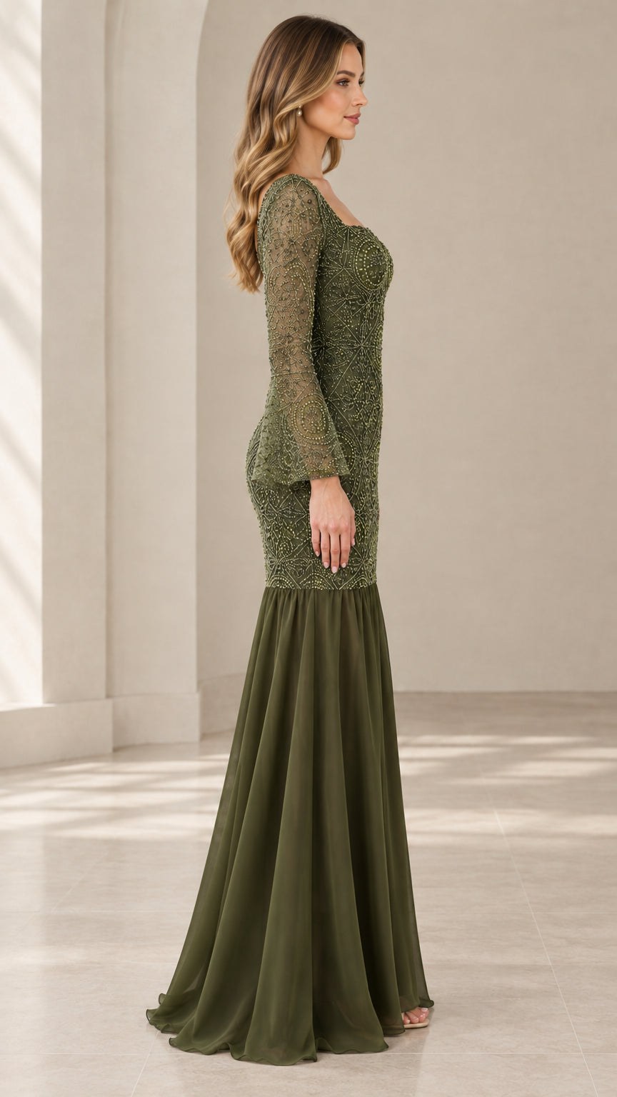Side profile view of woman modeling the olive green beaded maxi dress with flared chiffon hem