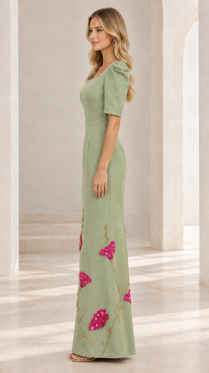Side profile view of woman wearing sage green puff sleeve formal evening gown