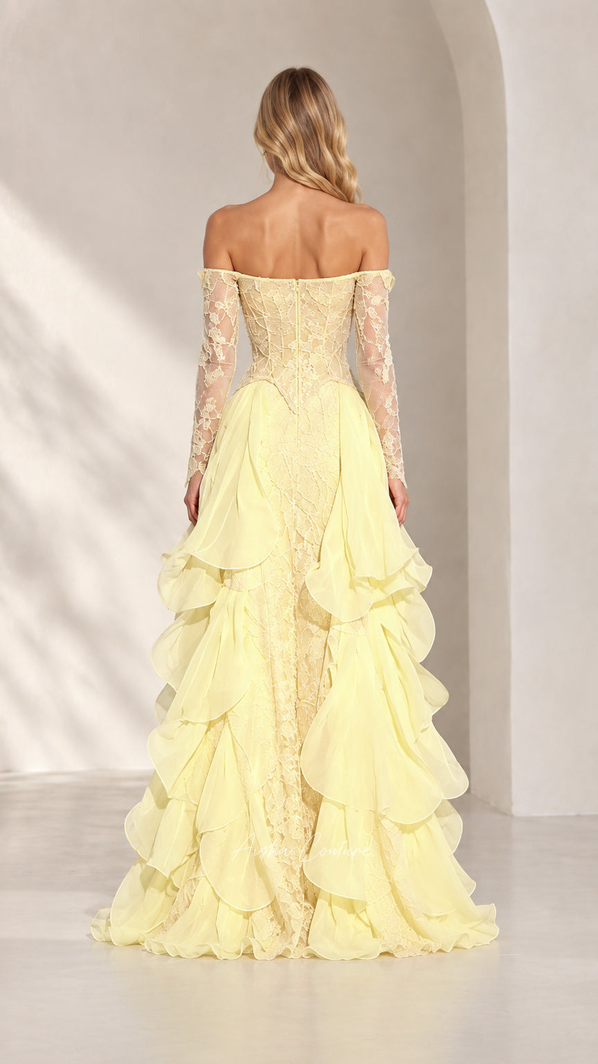 Back view of pastel yellow lace corset gown with long sleeves and cascading ruffles