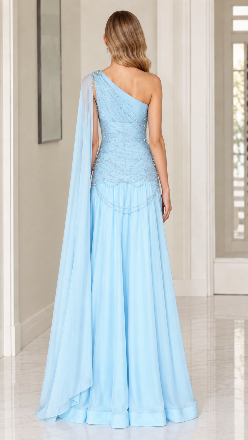 Back view of model wearing Ice Blue one-shoulder evening gown showcasing flowing chiffon cape