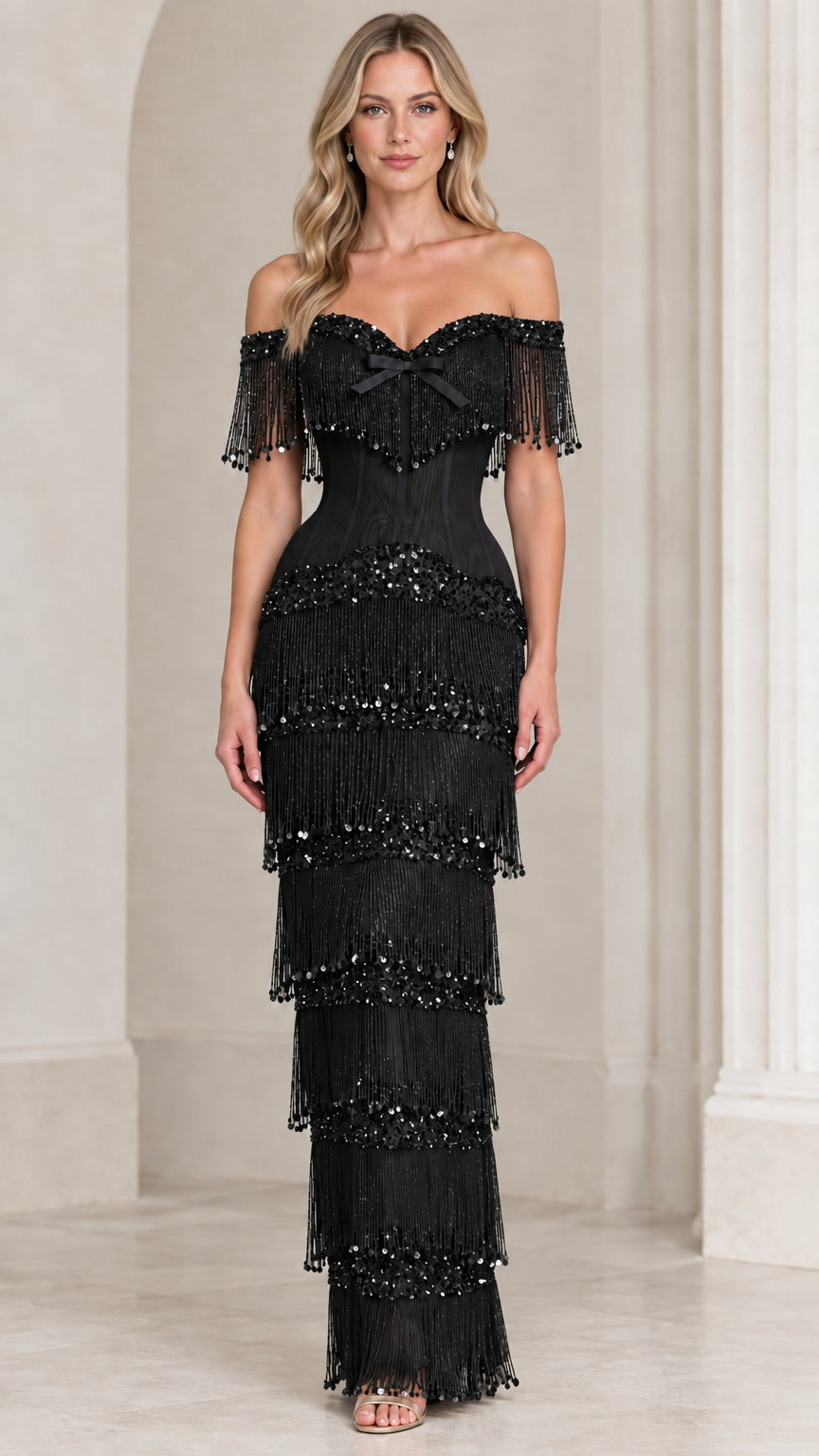 Front view of black off-the-shoulder tiered sequin fringe corset maxi gown