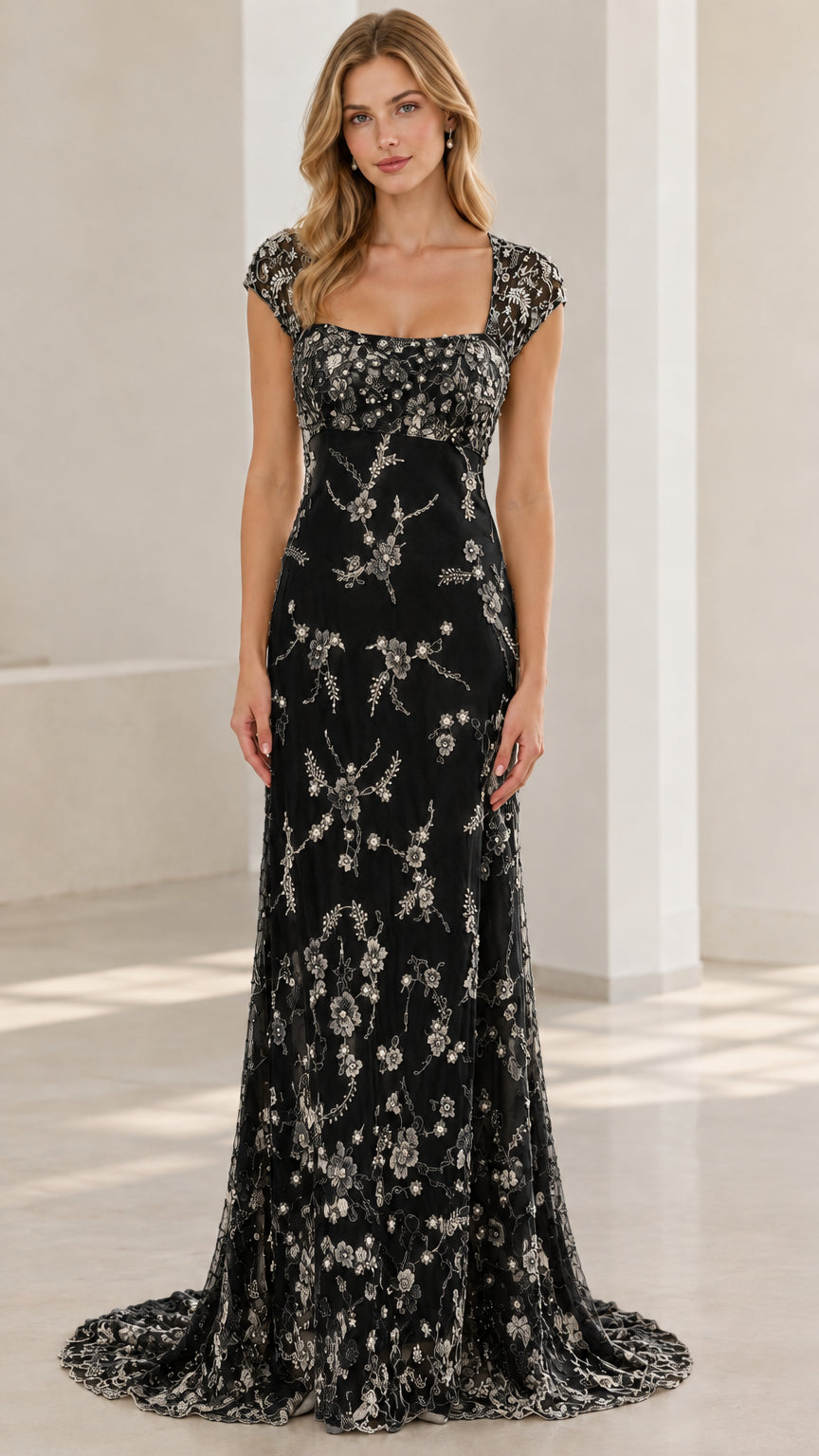 Black embroidered beaded cap sleeve evening gown front view