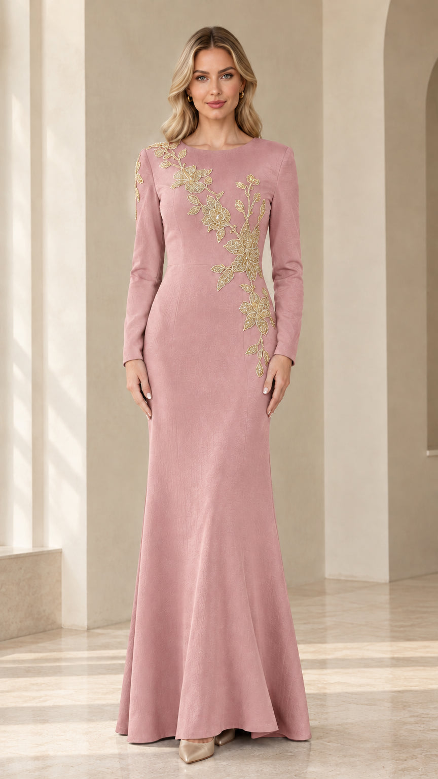 Model wearing dusty rose pink long sleeve evening gown with gold embroidery