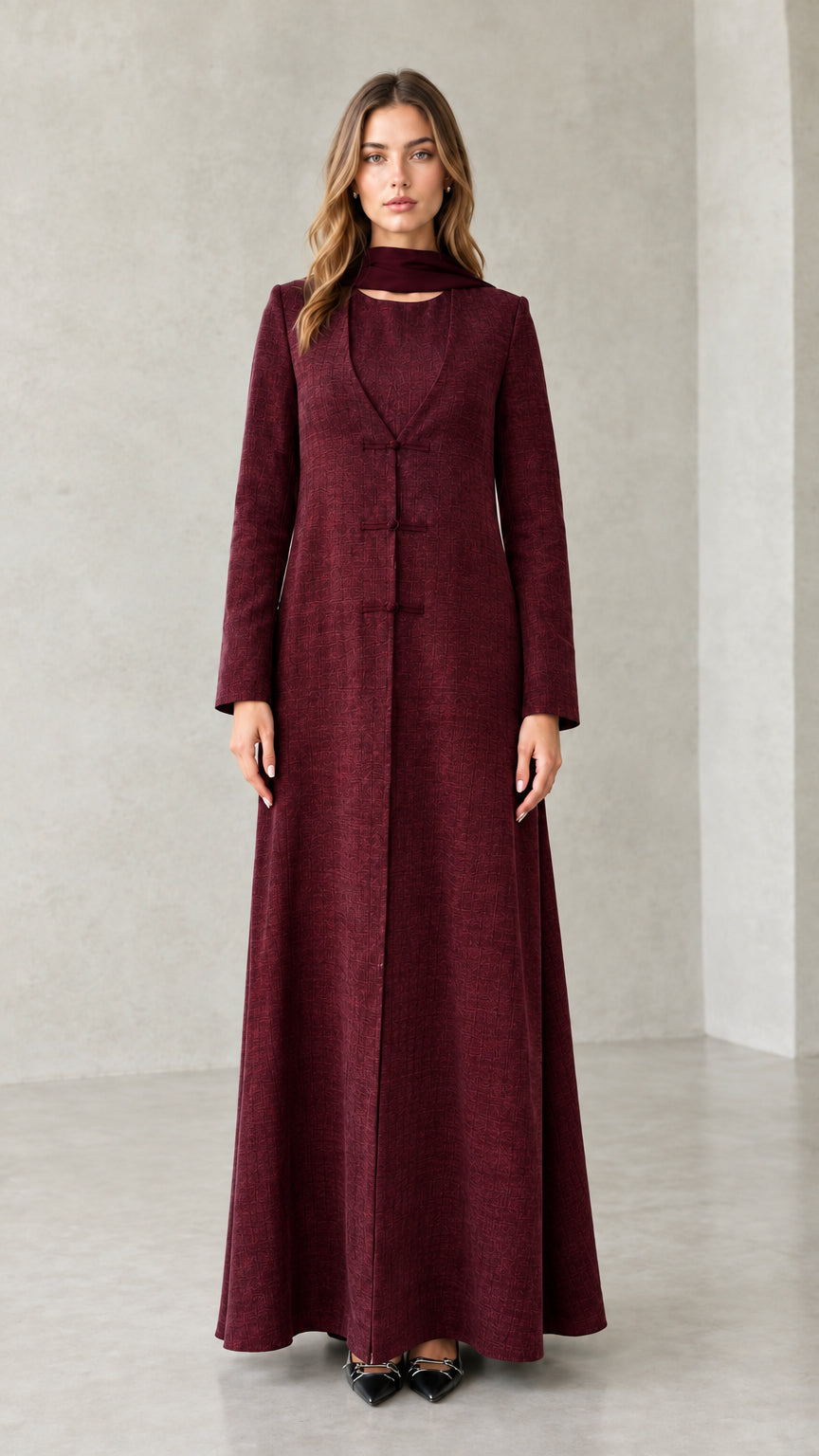 Front view of model wearing Burgundy textured long sleeve maxi coat dress