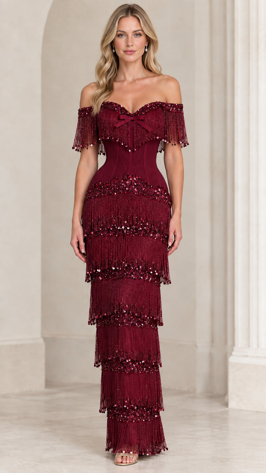 Front view of burgundy off-the-shoulder tiered sequin fringe corset maxi gown