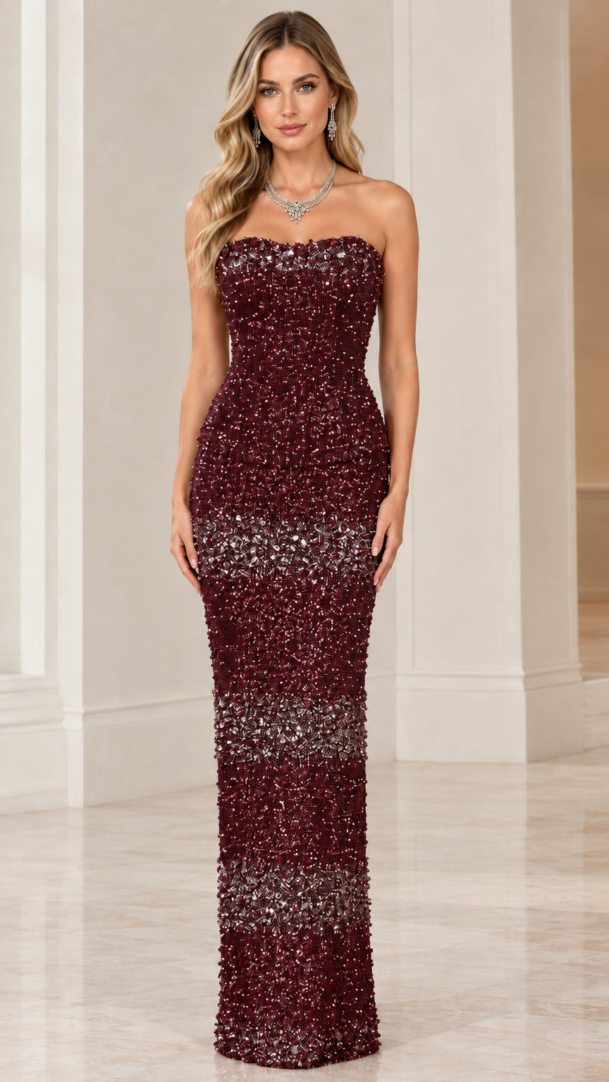 Model wearing burgundy red strapless beaded column evening gown